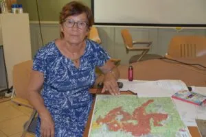 Mayor Nicole Rullan of Correns monitors the fire encircling her town